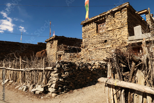 Some traditional rural houses in the mountain village of Ngawal, made from stone and wood, Annapurna Circuit Trek, Nepal photo