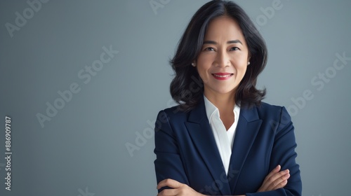 Confident MiddleAged Filipino Businesswoman in Professional Attire for Corporate, Marketing, and Diversity Use photo