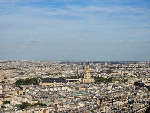 Paris, France - April 12, 2024: Aerial view of crowded Paris skyline with Seine River, Ile de France, France. Panorama view from Eiffel tower to the city skylines.
