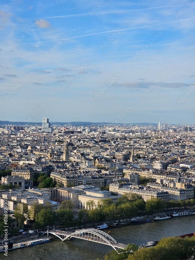 Paris, France - April 12, 2024: Aerial view of crowded Paris skyline with Seine River, Ile de France, France. Panorama view from Eiffel tower to the city skylines. Paris, France - April 12, 2024: Aerial view of crowded Paris skyline with Seine River, Ile de France, France. Panorama view from Eiffel tower to the city skylines.