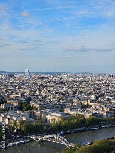 Paris, France - April 12, 2024: Aerial view of crowded Paris skyline with Seine River, Ile de France, France. Panorama view from Eiffel tower to the city skylines.