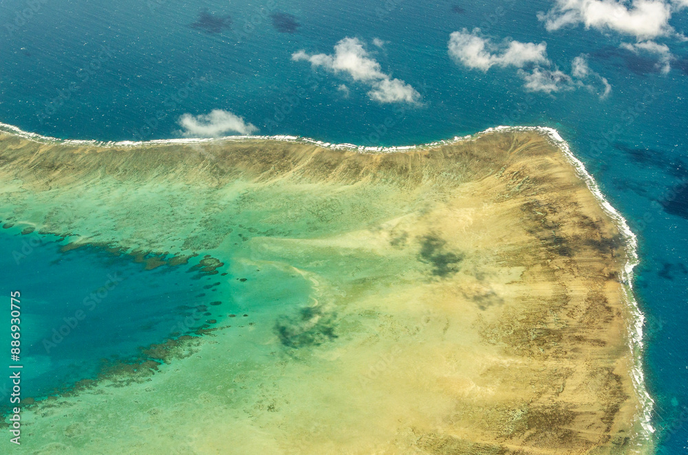 Spectacular aerial view on Great Barrier Reef on the way from Cairns to Lizard Island, Queensland, Australia. Great Barrier Reef is the worlds largest coral reef system.