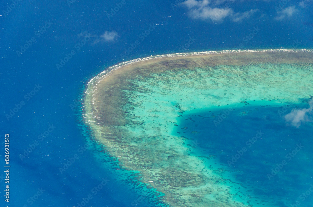 Spectacular aerial view on Great Barrier Reef on the way from Cairns to Lizard Island, Queensland, Australia. Great Barrier Reef is the worlds largest coral reef system.