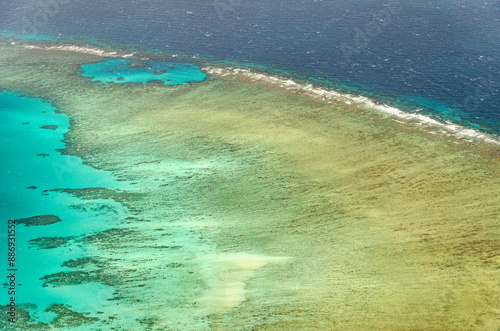 Spectacular aerial view on Great Barrier Reef on the way from Cairns to Lizard Island, Queensland, Australia. Great Barrier Reef is the worlds largest coral reef system. photo