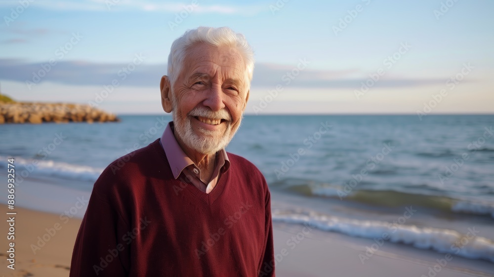Elderly man smiling by the ocean, calm waves, sunny weather Elderly man smiling by the ocean, calm waves, sunny weather