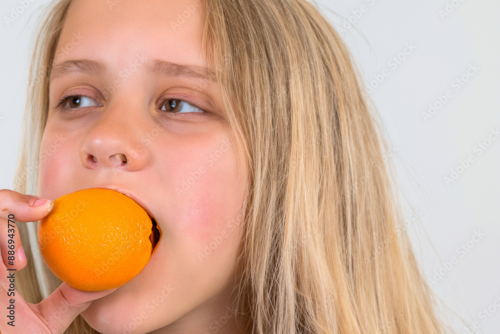Eating fruits and oranges is a healthy way to lose weight. Fruit food orange concept. A girl is eating sweets and oranges. A girl is eating fruits and vegetables lifestyle that are healthy. Eating fruits and oranges is a healthy way to lose weight. Fruit food orange concept. A girl is eating sweets and oranges. A girl is eating fruits and vegetables lifestyle that are healthy.