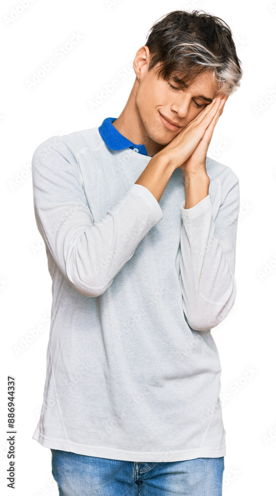Young hispanic man wearing casual clothes sleeping tired dreaming and posing with hands together while smiling with closed eyes. Young hispanic man wearing casual clothes sleeping tired dreaming and posing with hands together while smiling with closed eyes.
