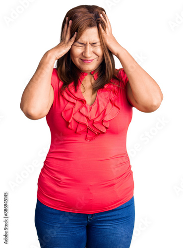 Middle age latin woman wearing casual clothes suffering from headache desperate and stressed because pain and migraine. hands on head.