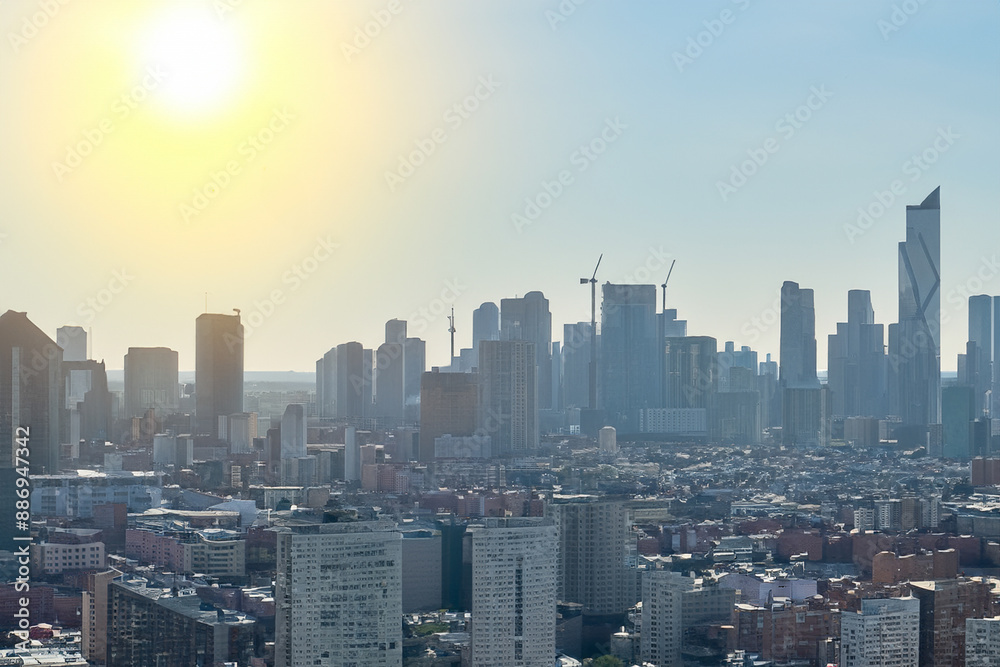 Rays of sun over megapolis on a foggy morning. urban sky sunrise concept. city illuminated by sun in the early morning. a city illuminated by the rays of the sun in lifestyle the early morning. Rays of sun over megapolis on a foggy morning. urban sky sunrise concept. city illuminated by sun in the early morning. a city illuminated by the rays of the sun in lifestyle the early morning.