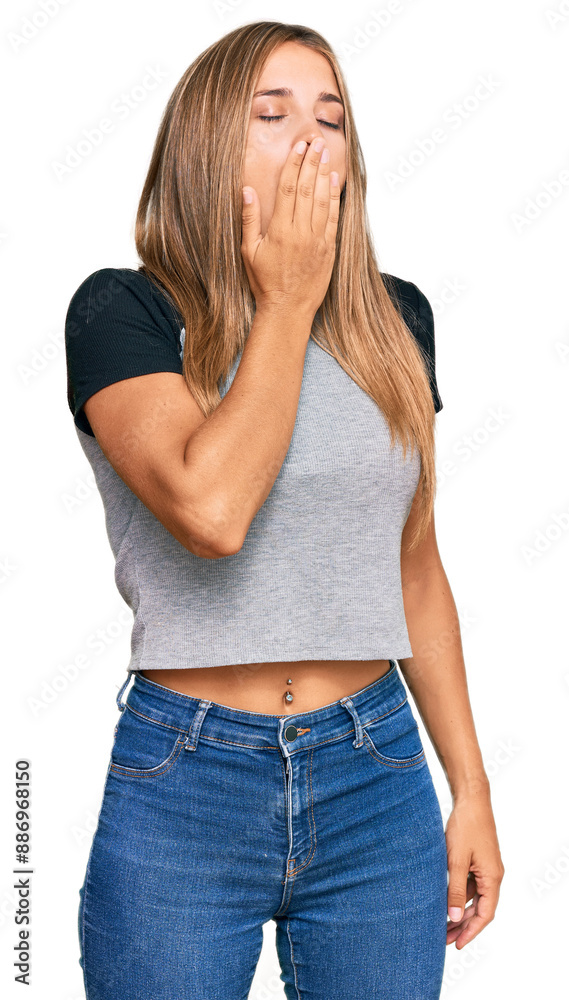 Young blonde woman wearing casual clothes bored yawning tired covering mouth with hand. restless and sleepiness. Young blonde woman wearing casual clothes bored yawning tired covering mouth with hand. restless and sleepiness.