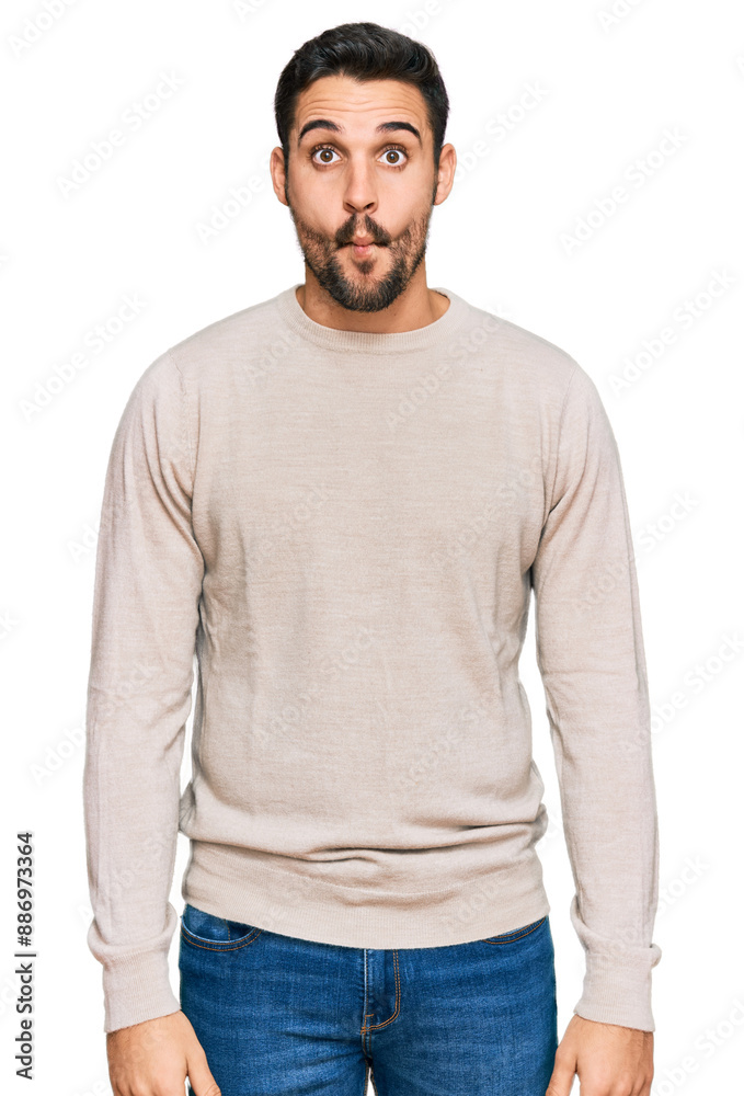 Young hispanic man wearing casual clothes making fish face with lips, crazy and comical gesture. funny expression. Young hispanic man wearing casual clothes making fish face with lips, crazy and comical gesture. funny expression.