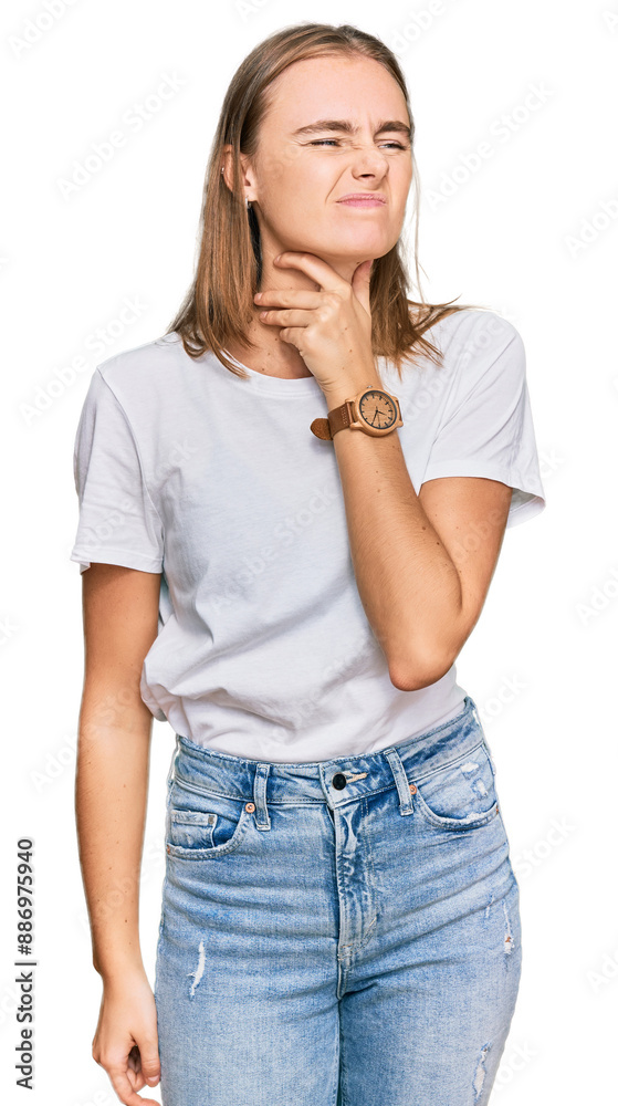 Beautiful young blonde woman wearing casual white t shirt touching painful neck, sore throat for flu, clod and infection Beautiful young blonde woman wearing casual white t shirt touching painful neck, sore throat for flu, clod and infection