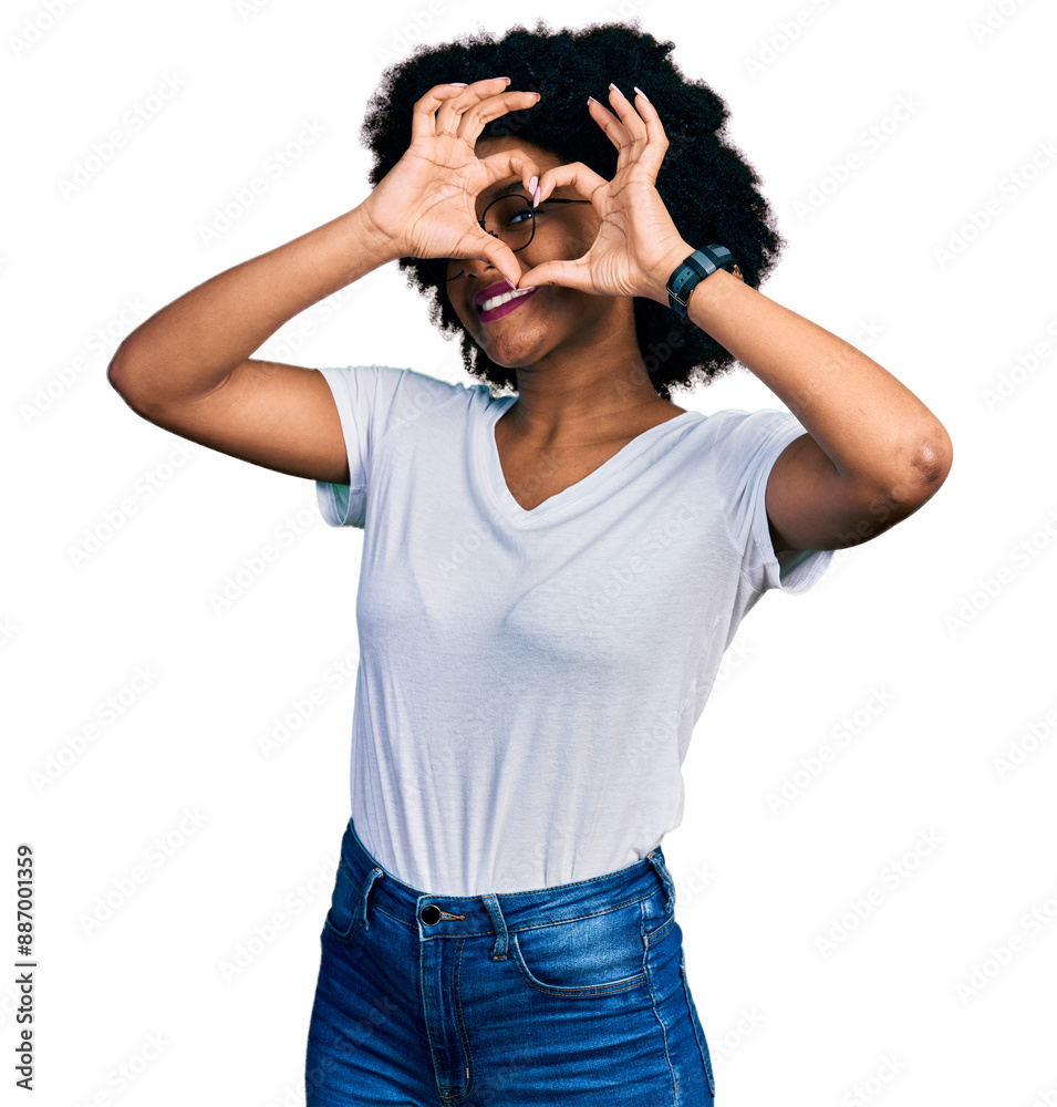 Young african american woman wearing casual white t shirt doing heart shape with hand and fingers smiling looking through sign Young african american woman wearing casual white t shirt doing heart shape with hand and fingers smiling looking through sign