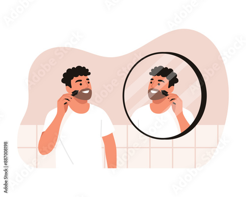 Vector illustration of a handsome man shaving his beard. Cartoon scene of a smiling man with curly hair, shaving with a beard trimmer, looking into a round mirror isolated on a white background.