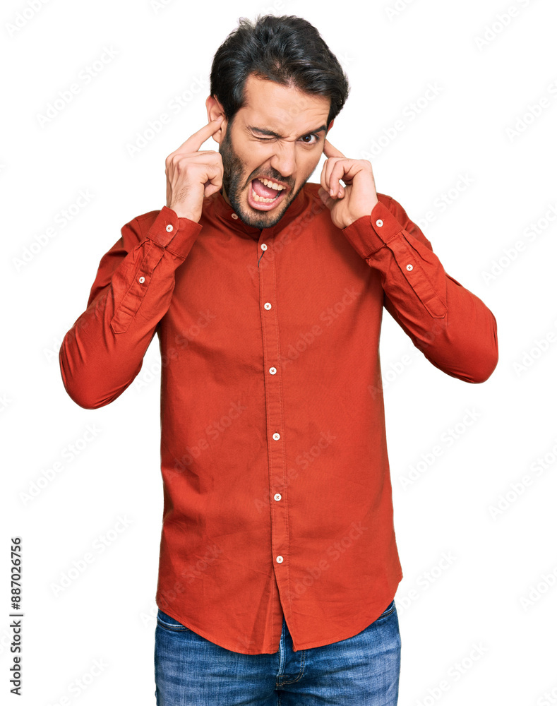 Young hispanic man wearing casual clothes covering ears with fingers with annoyed expression for the noise of loud music. deaf concept. Young hispanic man wearing casual clothes covering ears with fingers with annoyed expression for the noise of loud music. deaf concept.