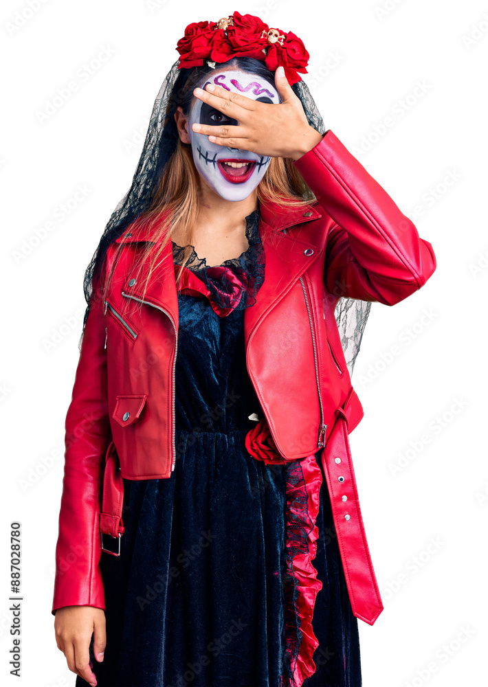 Φωτογραφία Woman wearing day of the dead costume over background peeking in shock covering face and eyes with hand, looking through fingers with embarrassed expression