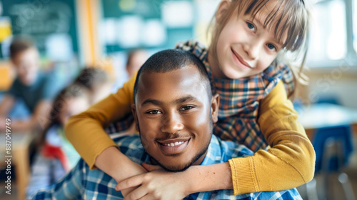 Teacher and student smiling together in a classroom setting