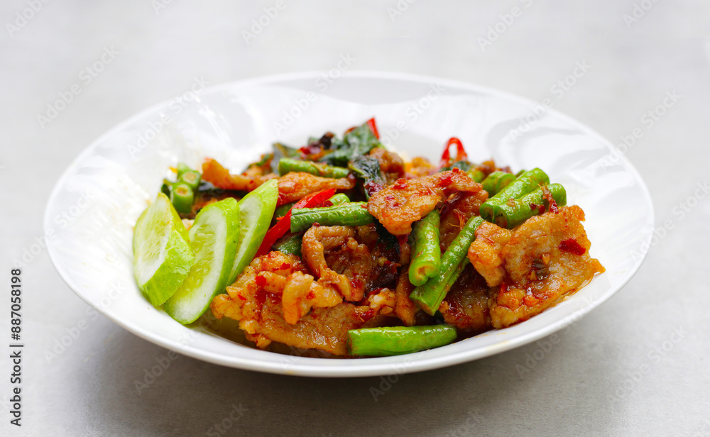 Rice topped with stir fried pork and red curry paste with yard-long bean Rice topped with stir fried pork and red curry paste with yard-long bean
