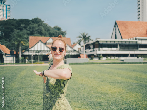 Photography Smiling Woman Enjoying a Sunny Day in Urban Park in Kuala Lumpur - Joyful Outdoo