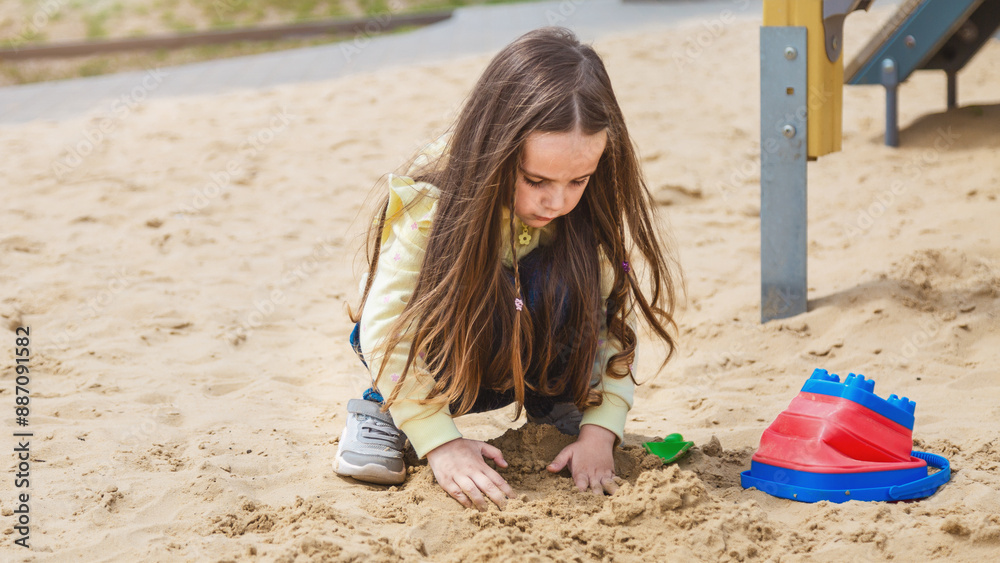 Children 's hands are touching plastic toys in the sand pits at the kindergarten, playground, sand play activities. Children 's hands are touching plastic toys in the sand pits at the kindergarten, playground, sand play activities.