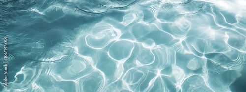 A close-up view of light blue water with ripples and waves creating intricate patterns.