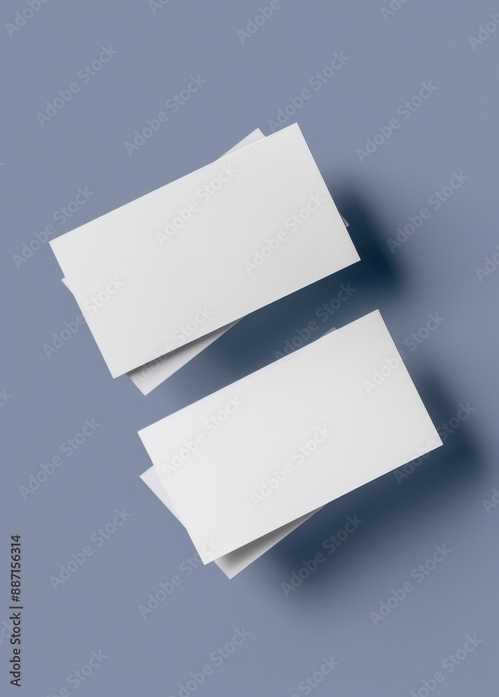 Two blank business cards side by side on light grey background, top view. Mockup for design with copy space Two blank business cards side by side on light grey background, top view. Mockup for design with copy space