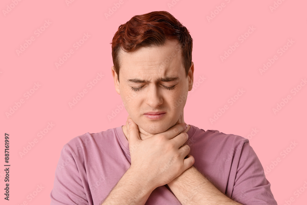 Young man with sore throat on pink background Young man with sore throat on pink background