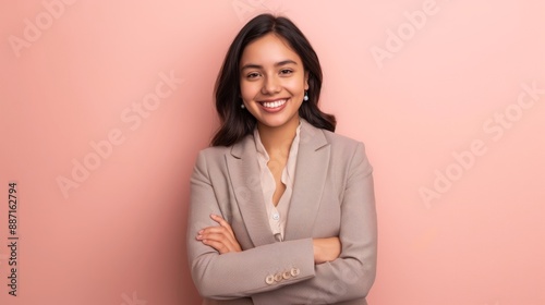 Professional Latina Businesswoman Smiling Confidently in Formal Attire on Pink Background for Corporate Designs