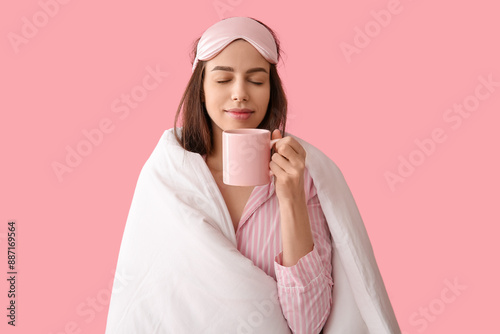 Young woman in pajamas and ...