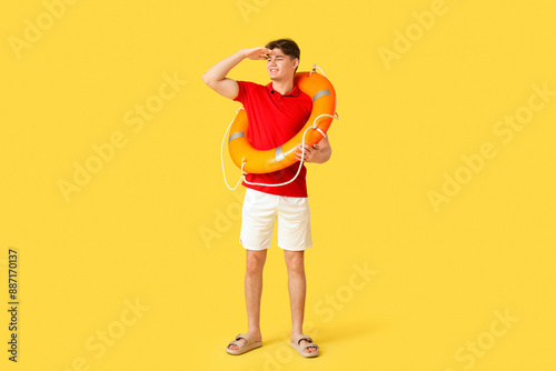 Male lifeguard with lifebuo...