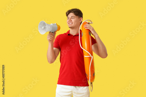 Male lifeguard with ring bu...