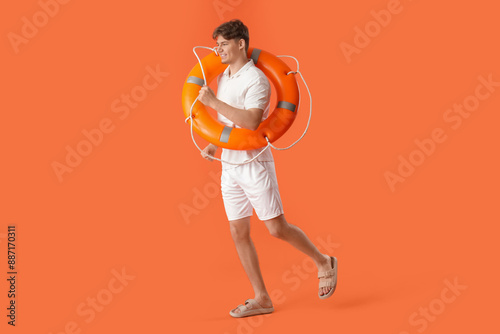 Male lifeguard with ring bu...