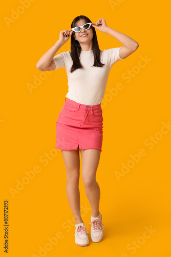 Young Asian woman in pink t...