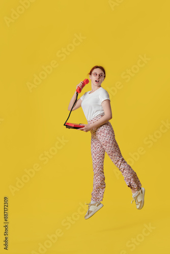 Young woman with telephone ...