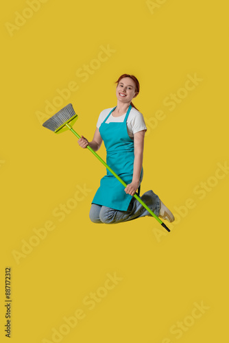 Female janitor with mop jum...