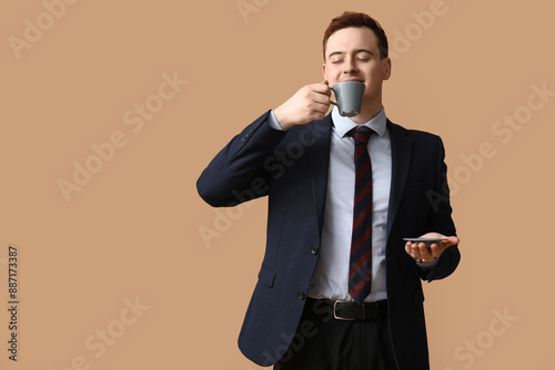 Young man in suit enjoying ...