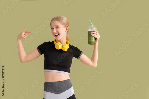 Happy sporty young woman po...