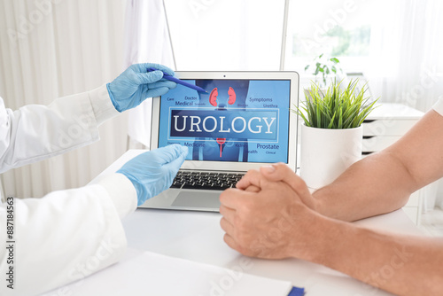 Male urologist working with...