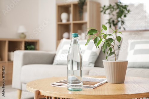 Bottle of water with magazi...