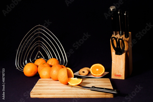 still life with orange and knife