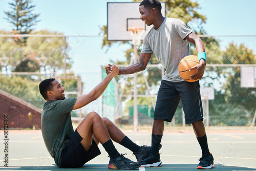 Fototapeta Naklejka Na Ścianę i Meble -  Basketball, sports and teamwork, helping hand and support, respect and assistance in competition training games. Happy basketball player holding hands with friend, trust and kindness on outdoor court