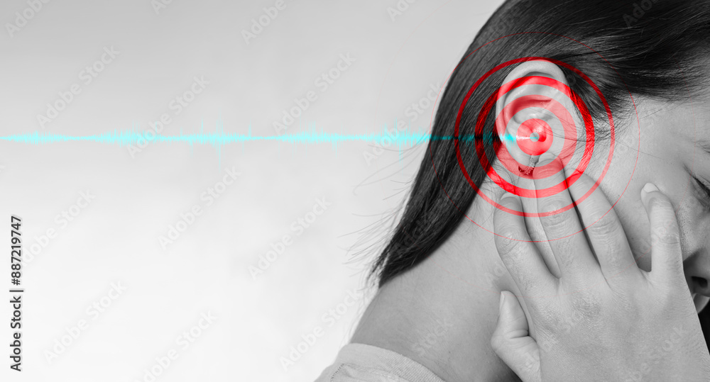 Naklejka premium Noise Pollution, a Health Threat. Young woman suffering from ear pain and tinnitus.