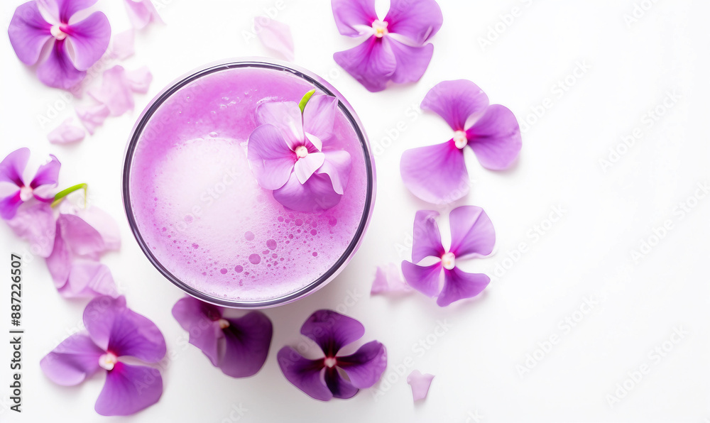 Purple cocktail drink in a glass on white background Purple cocktail drink in a glass on white background