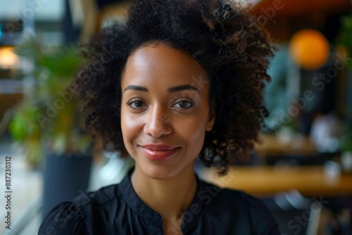 Charismatic Multi-Ethnic Businesswoman Smiling Confidently into the Camera, Representing Strength and Professionalism in Information Technology and Software Engineering.
