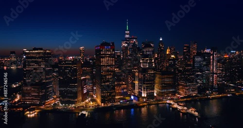 Wallpaper Mural Dazzling skyline of Manhattan, New York, the USA at night. Drone approaches the architecture at the waterfront of the East River. Torontodigital.ca