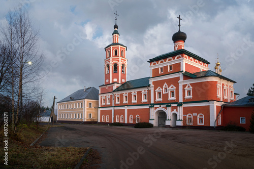 View of the gate Ascension Church of the Vyazma Ioanno-Predtechensky monastery on a sunny day with clouds, Vyazma, Smolensk region, Russia photo