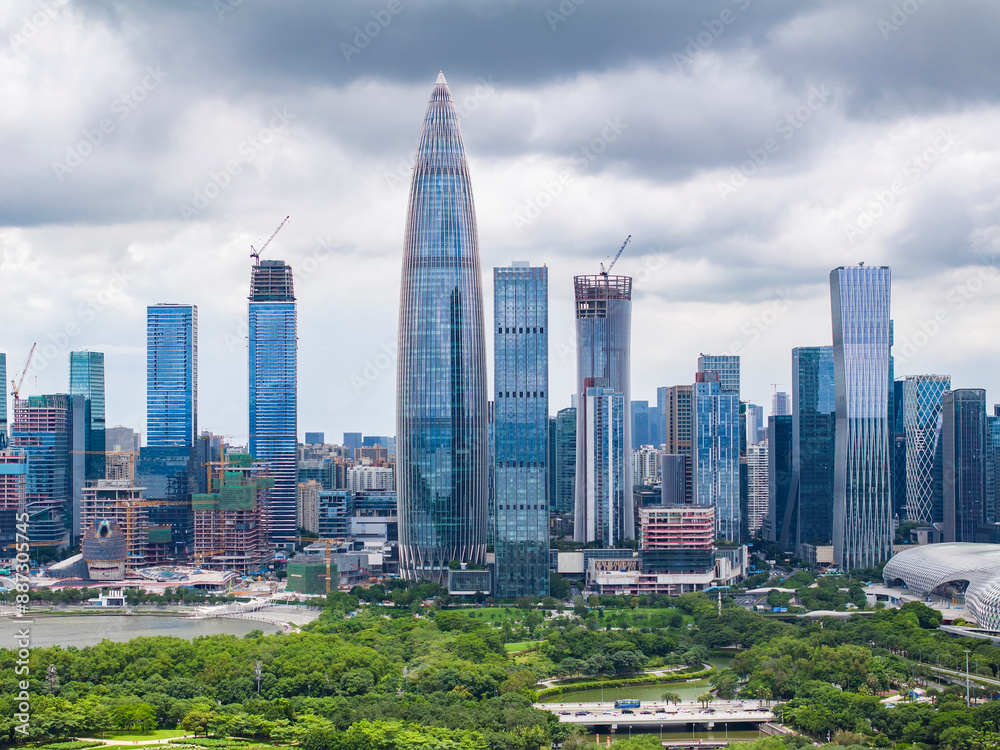 Fototapeta premium Park in city of Shenzhen China,beautiful mix of green trees combined with buildings, modern architecture, totally blue skies.