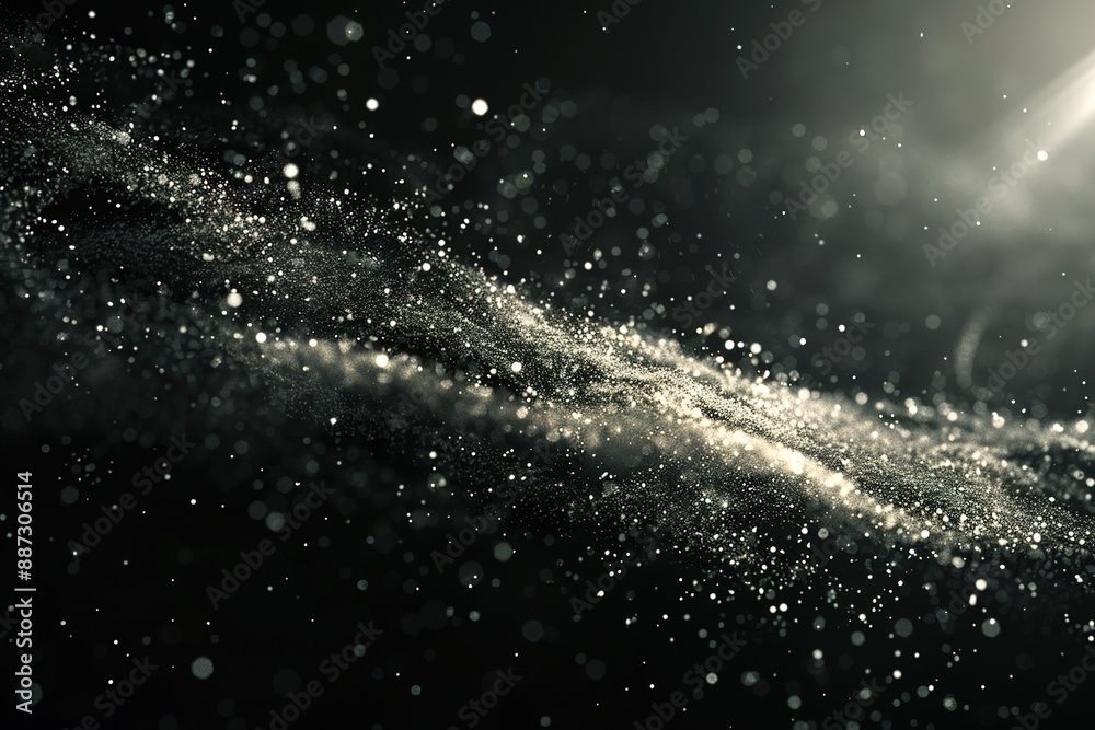 A black and white image of a long, wavy line of glitter A black and white image of a long, wavy line of glitter