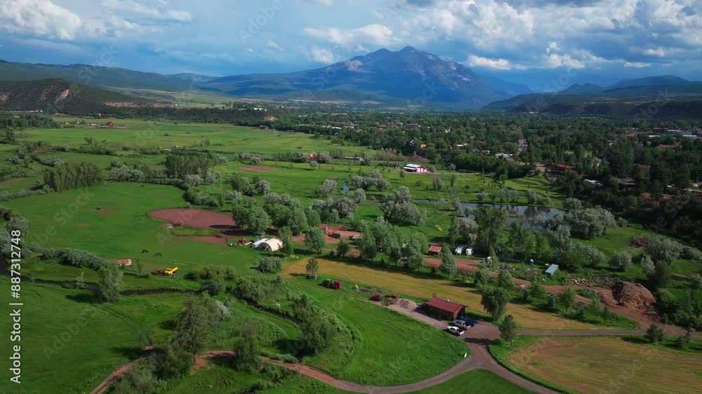 Spring Creek Ranch Mt Sopris Carbondale Roaring Fork River Aspen Snowmass summer aerial drone Colorado June July Rocky Mountain snow cap peaks Marble El Jebel Marble Basalt clouds sunny forward pan up Spring Creek Ranch Mt Sopris Carbondale Roaring Fork River Aspen Snowmass summer aerial drone Colorado June July Rocky Mountain snow cap peaks Marble El Jebel Marble Basalt clouds sunny forward pan up
