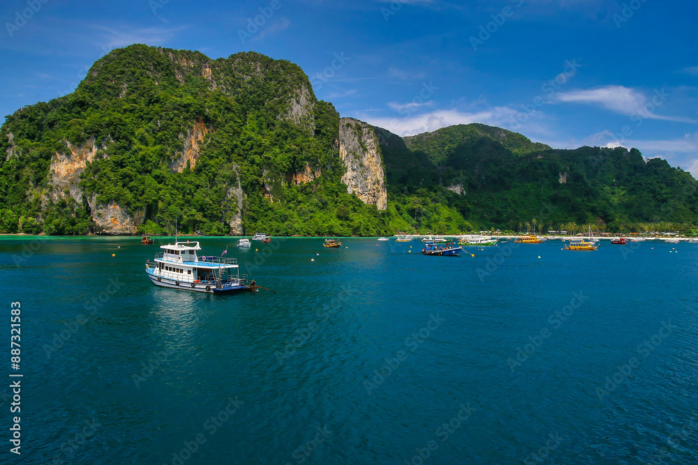 A View of floating travelers boats and beautiful sceanery at Ko Phi Phi Don in Phuket. A View of floating travelers boats and beautiful sceanery at Ko Phi Phi Don in Phuket.